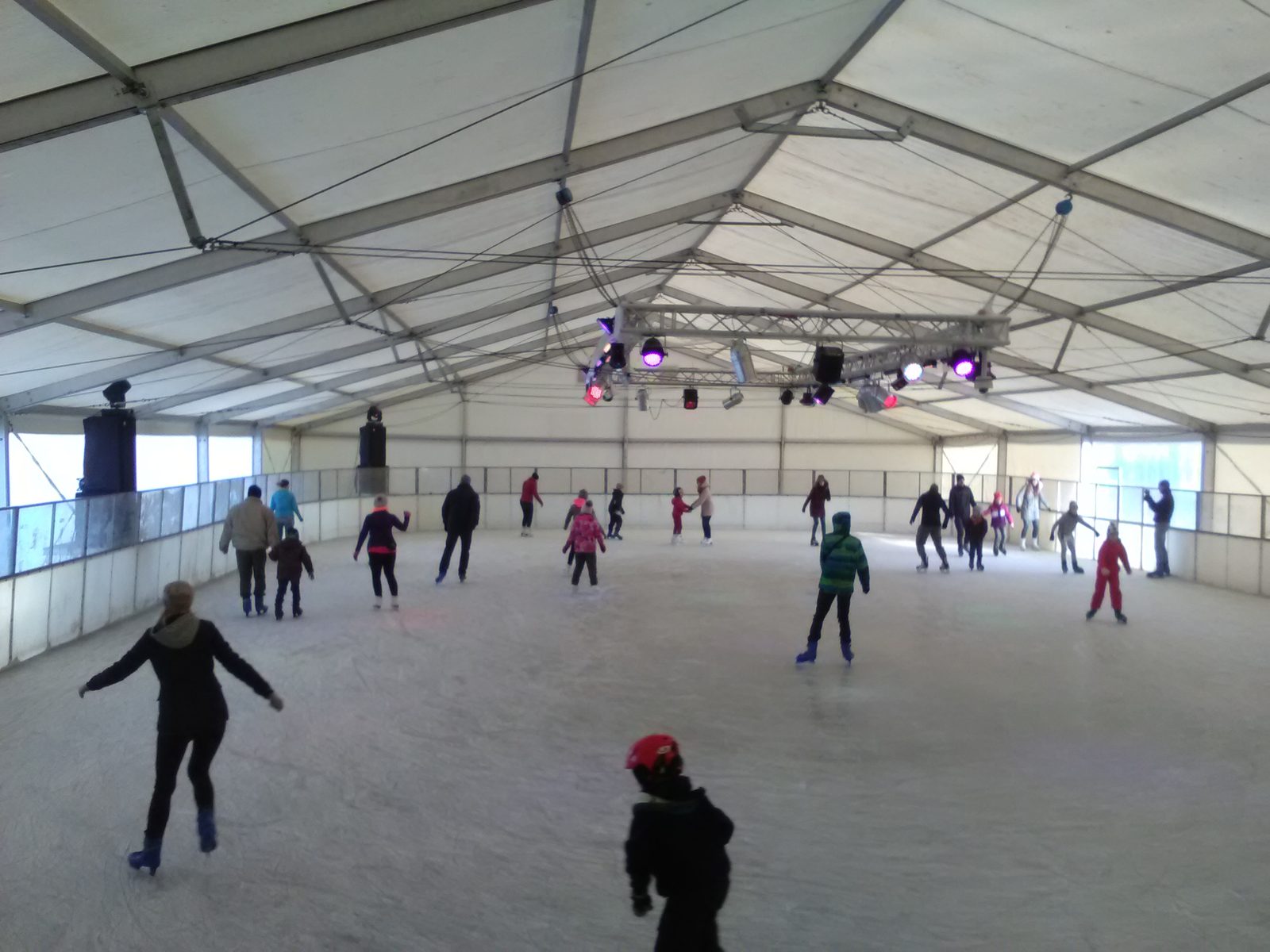 Skaters on the ice inside the tent of the Malta Ice Rink (photo from 2016)