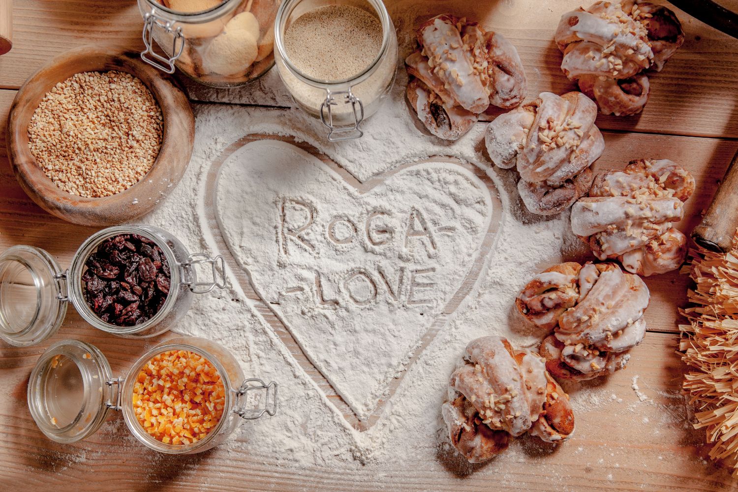 St Martin's croissants and ingredients (almonds, raisins, candied peel) around a heart drawn in flour with the words ROGA-LOVE